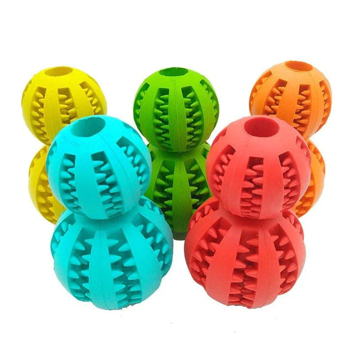 Premium natural rubber interactive ball for dogs in various colours, designed to provide mental stimulation and physical exercise.
