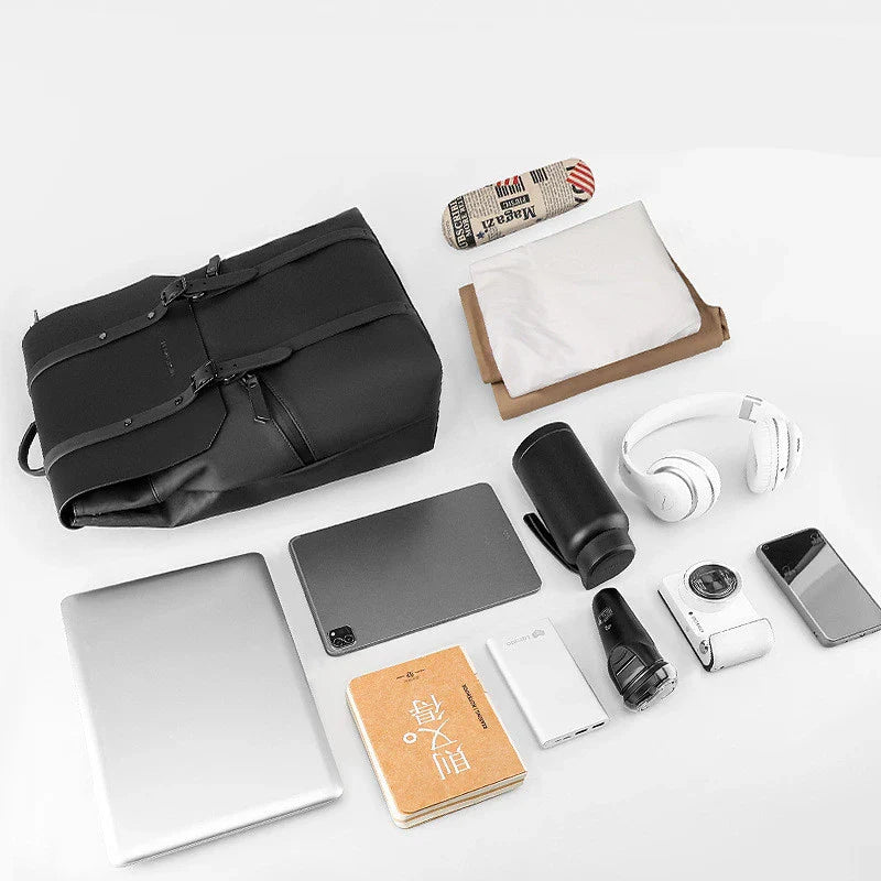 A stylish and functional large capacity backpack in black, featuring multiple pockets and a dedicated laptop compartment for school, travel, and work use.