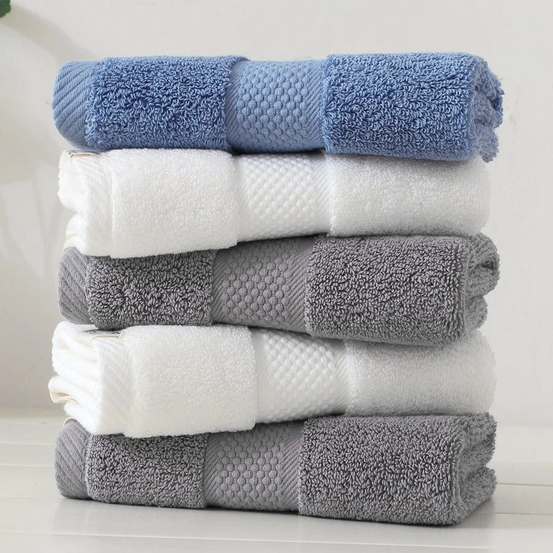 Premium 100% cotton face towel in blue, featuring a soft and absorbent design for daily facial cleansing and bathing