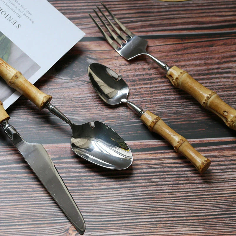 Mirror finish stainless steel cutlery set with bamboo handles, designed for elegant dining experiences