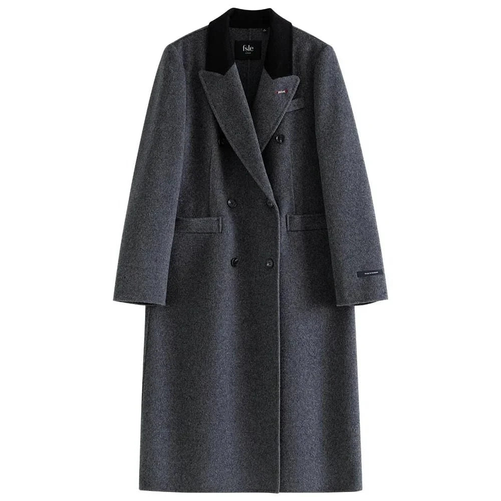 A sophisticated and stylish dark grey woollen coat for women, designed with a timeless double-breasted closure and notched collar.