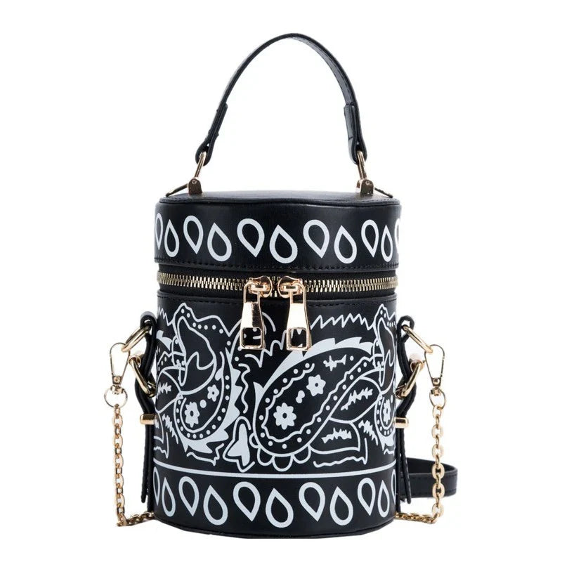 Premium PU leather bucket bag in a variety of classic and contemporary colours, featuring a spacious main compartment, adjustable shoulder strap, and sophisticated British-inspired design.