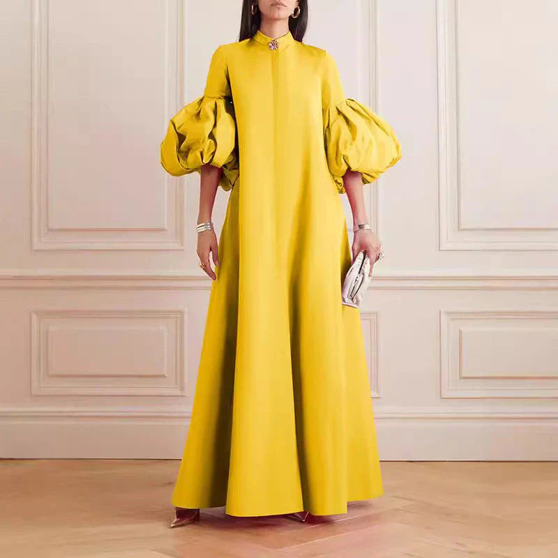 Elegant floral evening gown in a range of vibrant colours, featuring a loose, flattering fit and chic lapel design