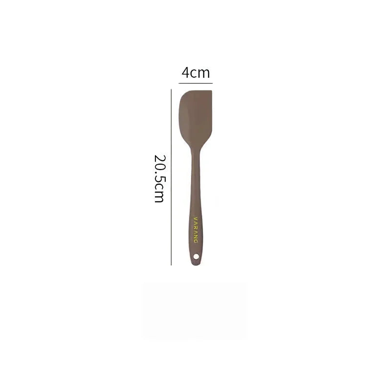 A set of two high-quality silicone spatulas in brown and yellow colours, designed for versatile cooking and baking tasks.