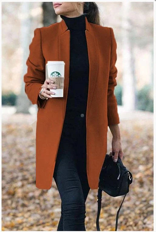 Premium British woollen coat with stand collar, featuring a sleek, slim-fit silhouette and subtle stitching details