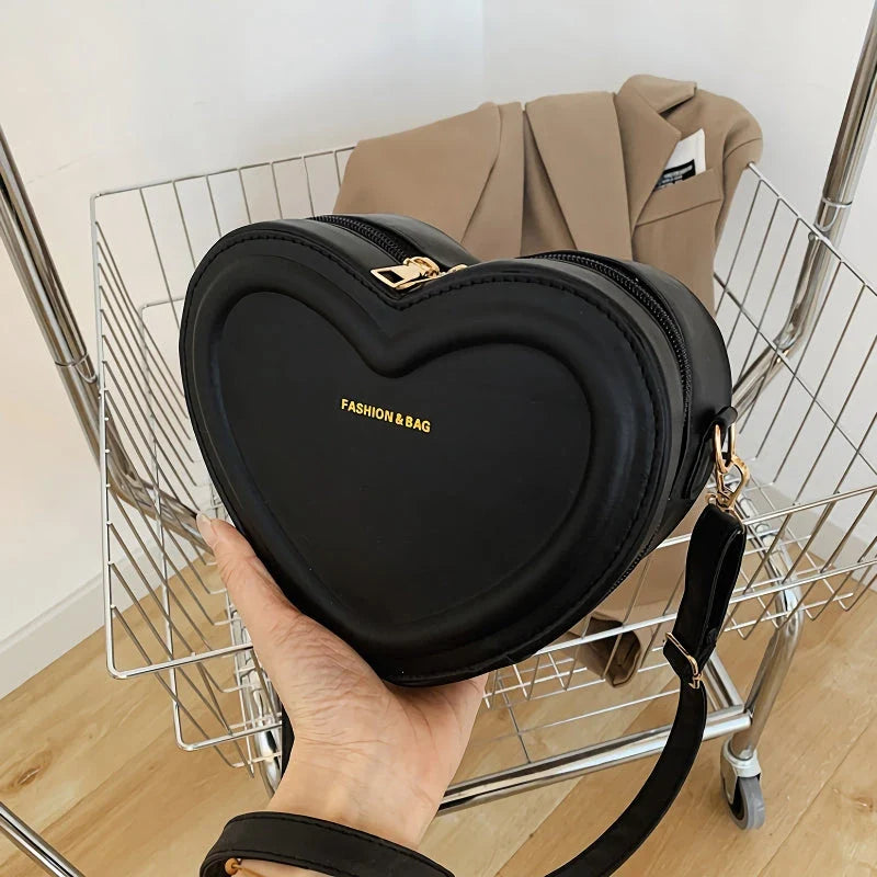 Chic heart-shaped crossbody bag made from premium PU leather, available in multiple stylish colours
