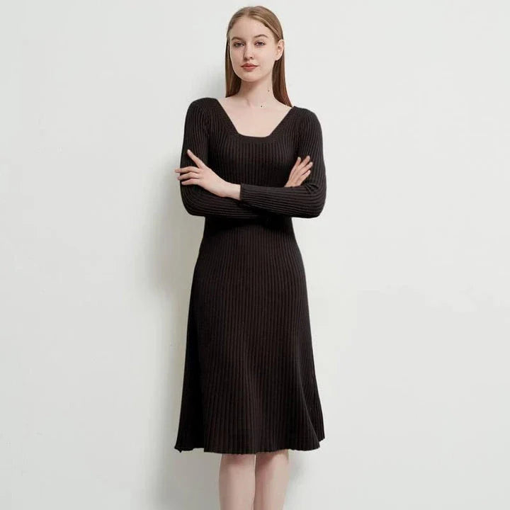 Elegant and cosy midi sweater dress in black, featuring a solid, body-hugging silhouette and comfortable knit fabric