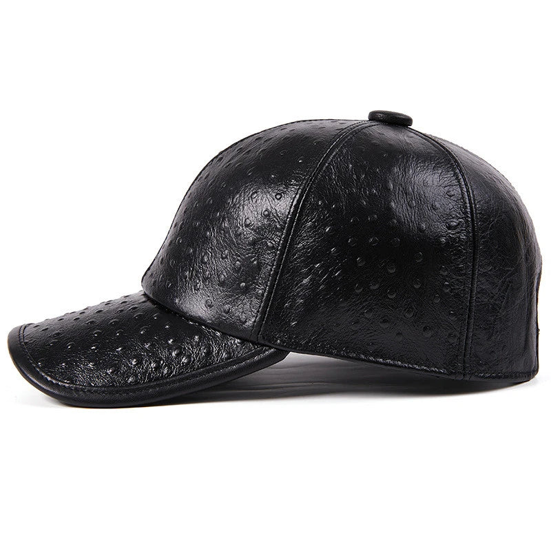 A stylish men's baseball cap made from warm, first-layer cowhide leather with an eye-catching ostrich pattern design.