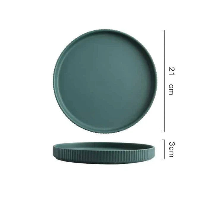 Candy-coloured ribbed ceramic tableware featuring plates, bowls, and other dining accessories in vibrant hues