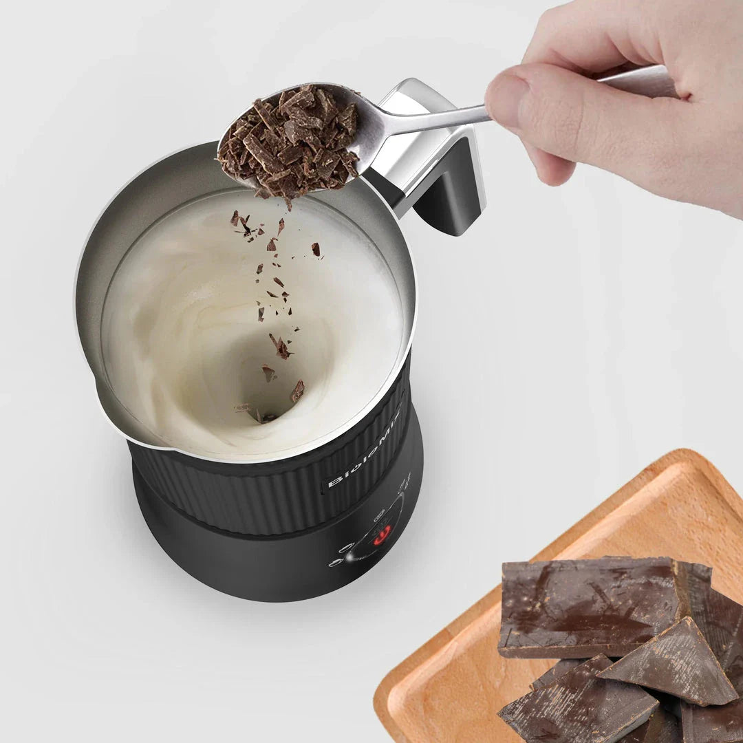 A stainless steel and black 5-in-1 automatic milk frother that can create hot, cold, and frothed milk for delicious coffee, latte, cappuccino, and hot chocolate drinks