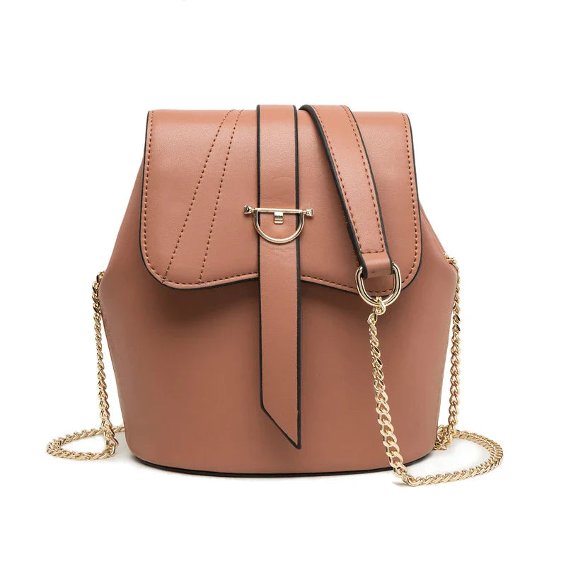 A large capacity chain bag with a classic bucket silhouette, crafted from premium leather-look material for sophisticated British style.