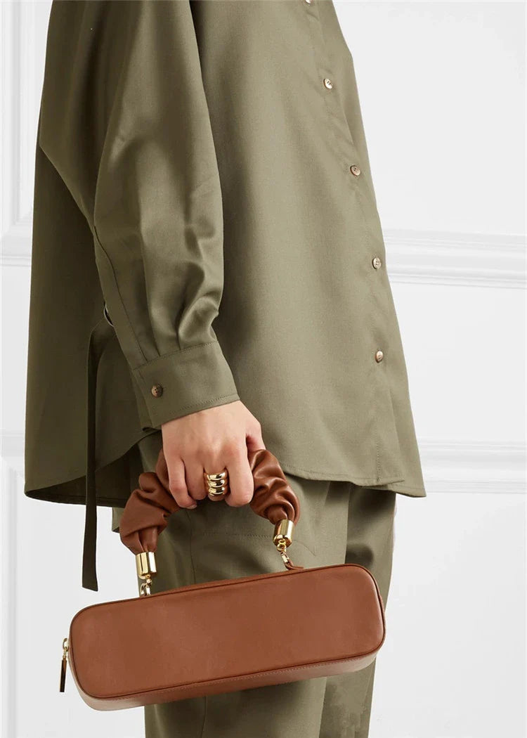 Sophisticated long shoulder diagonal bag with a sleek horizontal square design, made of durable synthetic leather and featuring a single shoulder strap for hands-free convenience.