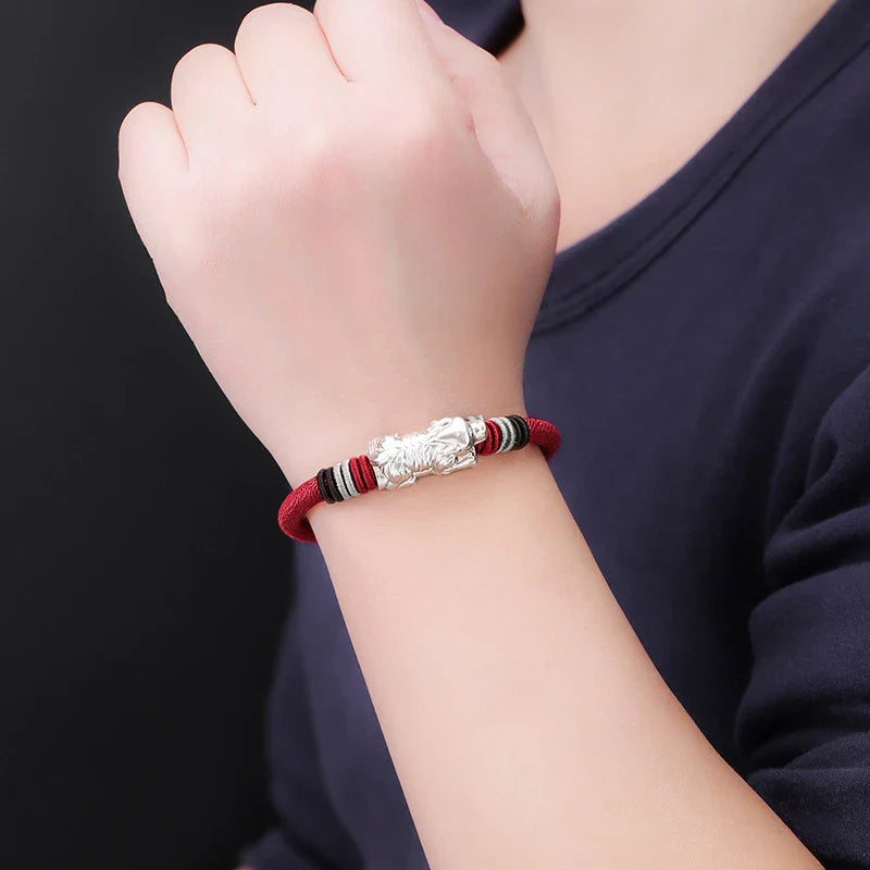 A premium hand-woven bracelet crafted with silver material, featuring a geometric design for a modern and sophisticated look.