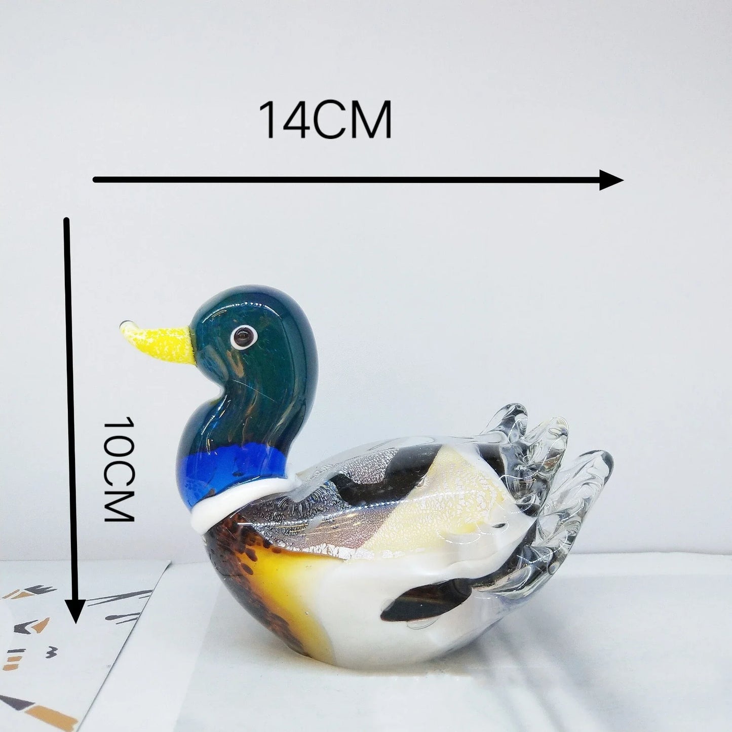 Handcrafted glass ornament in the shape of a Mandarin duck with vibrant colours and intricate details