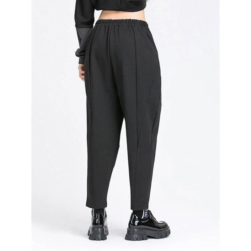Stylish high elastic waist black harem trousers with a split joint design, offering a comfortable and fashionable look