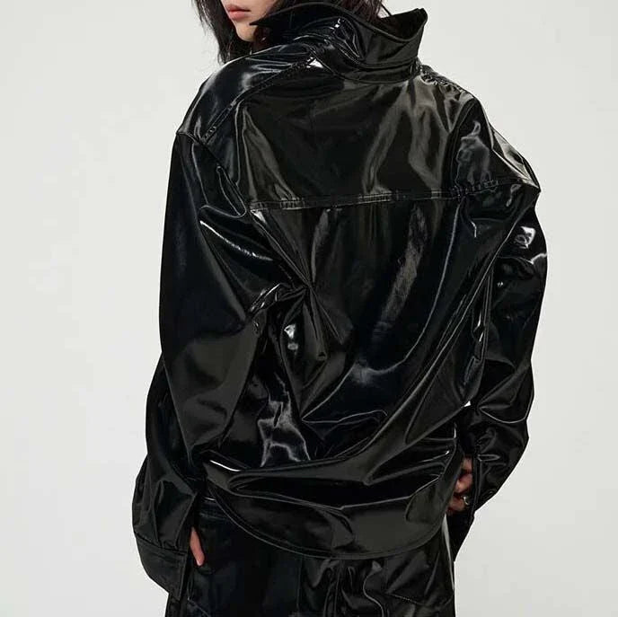 Elegant, fleece-lined PU leather jacket in a sleek, glossy black finish for timeless style and comfort