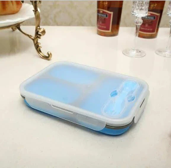 Collapsible silicone lunch box in orange colour, featuring a leakproof design and 1100ml capacity for on-the-go meals.