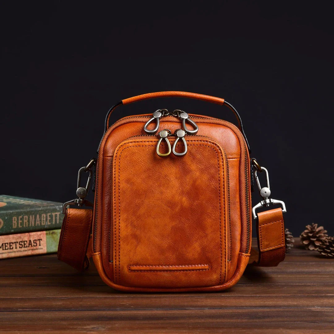 Premium retro leather messenger bag with spacious main compartment, side pockets, and robust handle for comfortable carrying