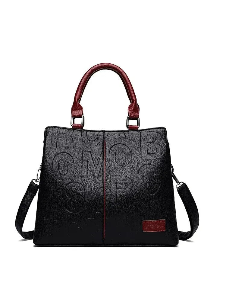 Sophisticated large leather tote bag with embossed lettering design, suitable for daily use and travel