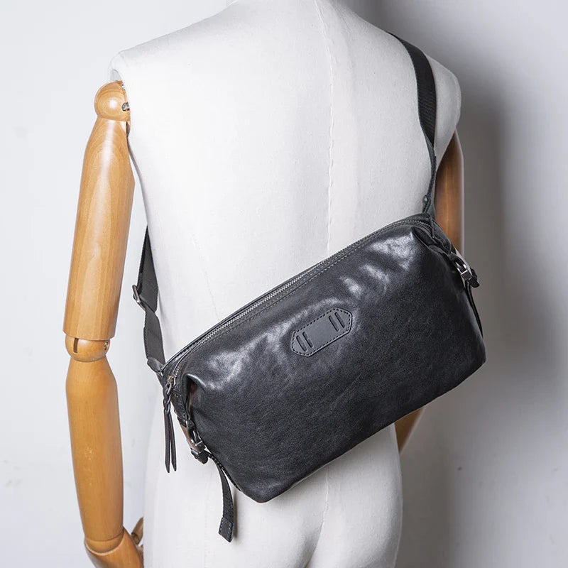 Premium top-grain cow leather messenger bag with large capacity and multiple pockets for organised storage