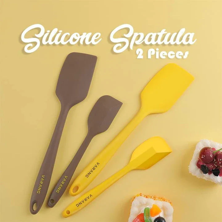 A set of two high-quality silicone spatulas in brown and yellow colours, designed for versatile cooking and baking tasks.