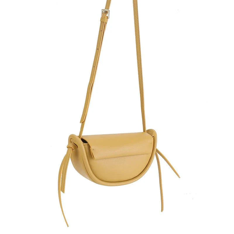 Premium cowhide leather crossbody bag in a distinctive semicircle shape, available in classic colours to complement any UK wardrobe
