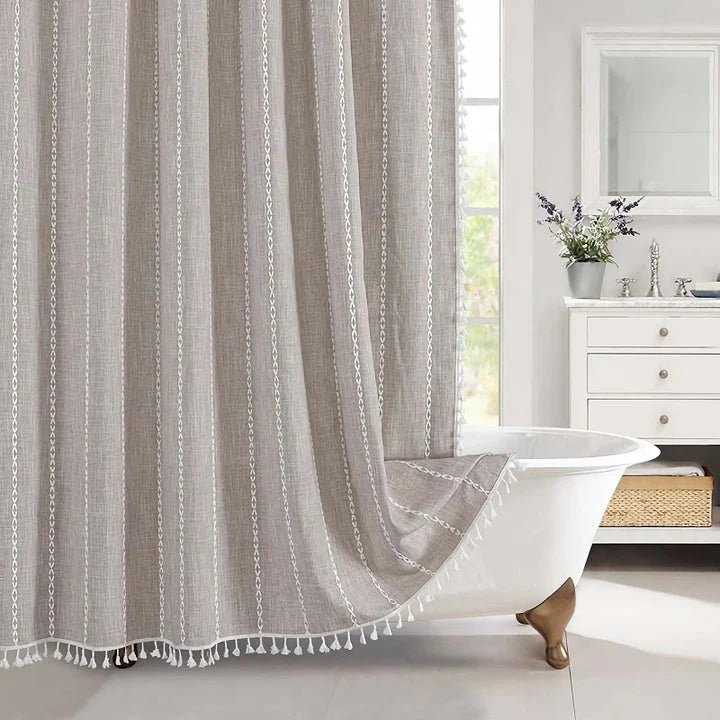 Premium bohemian tassel shower curtain with unique stitching design, waterproof coating, and durable linen blend material for a relaxing bathroom oasis