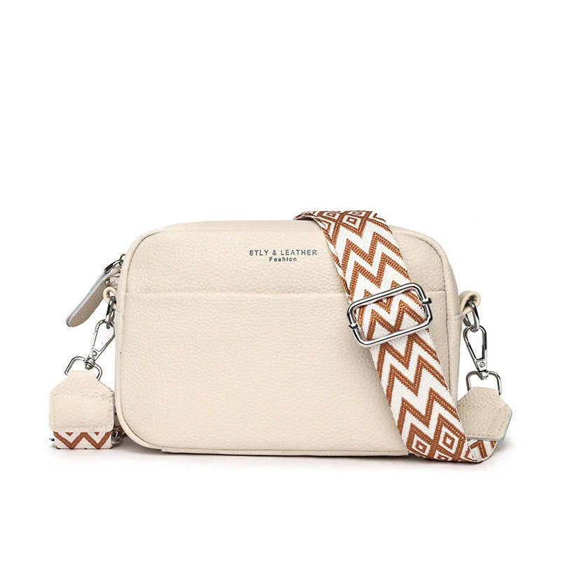 Stylish leather crossbody bag with embroidered strap in various colours