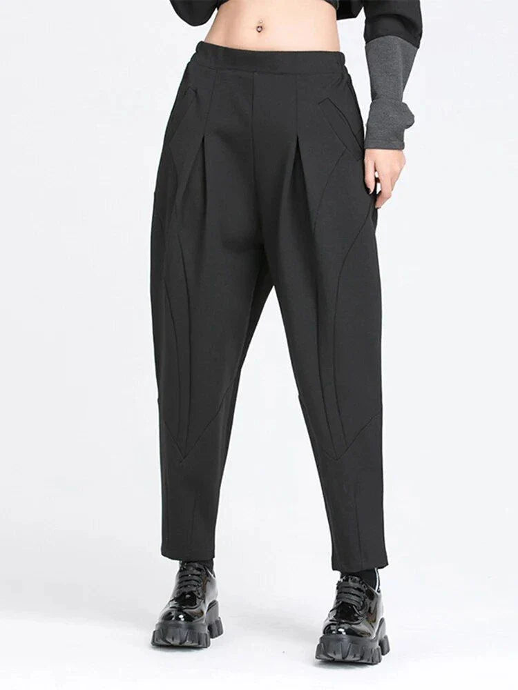 Stylish high elastic waist black harem trousers with a split joint design, offering a comfortable and fashionable look