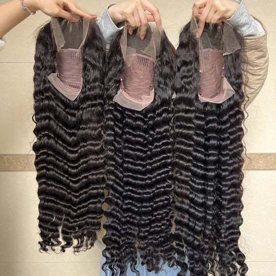 Luxurious deep wavy human hair wig with natural lace construction, available in various lengths for a customized, elegant look.