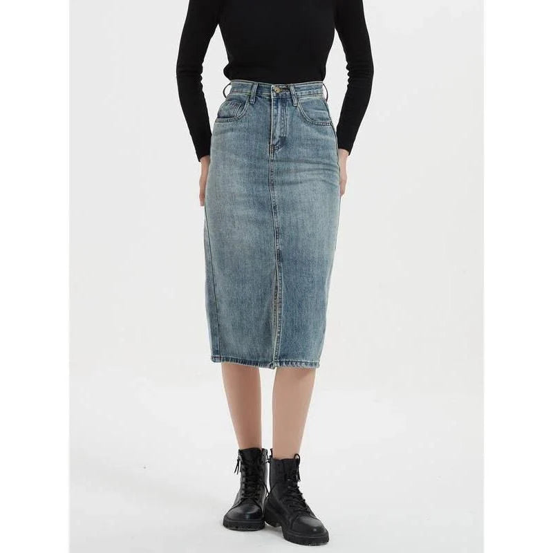 A high-waist denim pencil skirt with a classic A-line silhouette, perfect for the modern British woman.