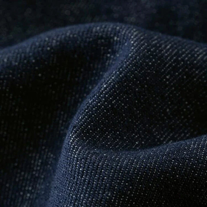 Dark denim high-waist loose shorts with retro pleated design, offering comfort and style for the modern British woman.