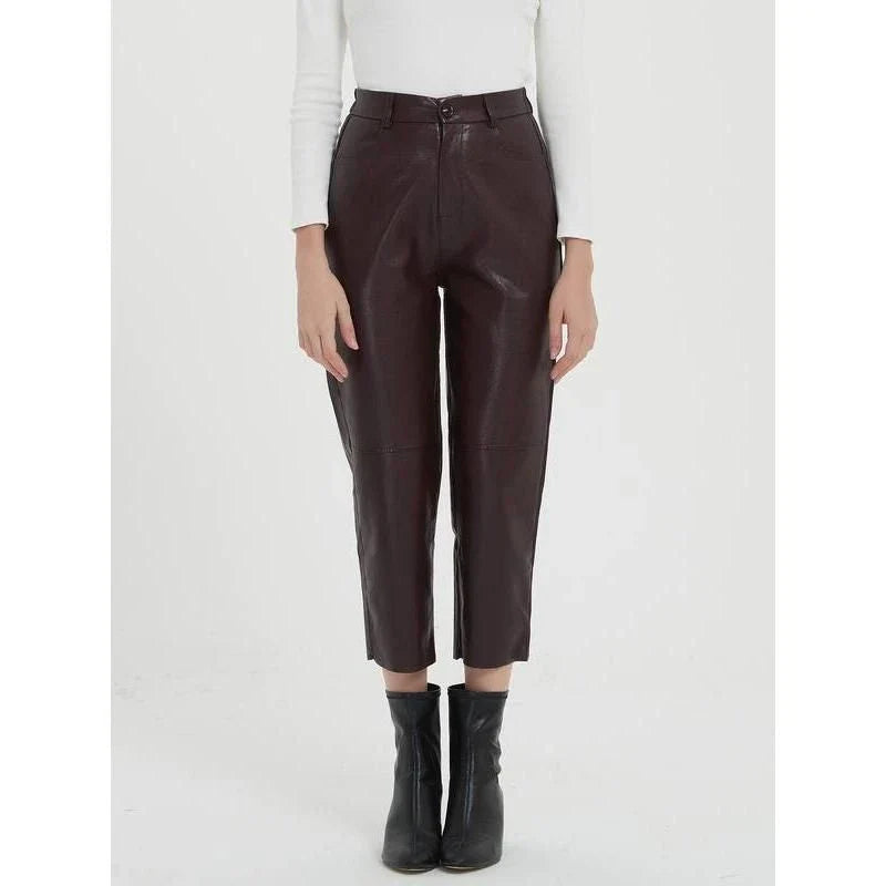 Pair of high-waisted, ankle-length faux leather trousers in a classic brown colour