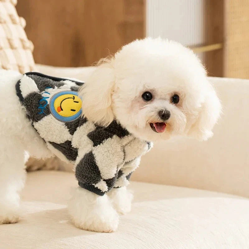 A stylish checkered fleece coat for small and medium-sized dogs, providing warmth and comfort during the chilly British autumn and winter seasons.