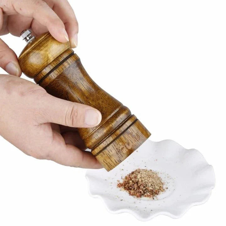 Premium eco-friendly wooden spice grinder with stainless steel accents, designed for consistent spice grinding and sustainable kitchen use.