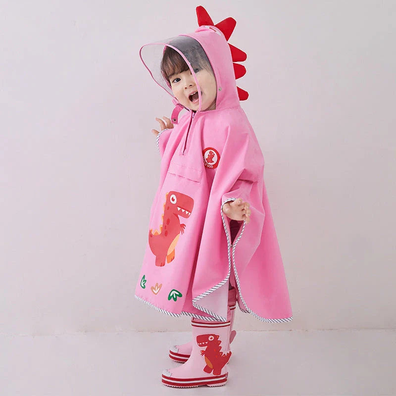 A colourful dinosaur-themed waterproof rain poncho for children, designed to keep them dry and happy during outdoor activities.