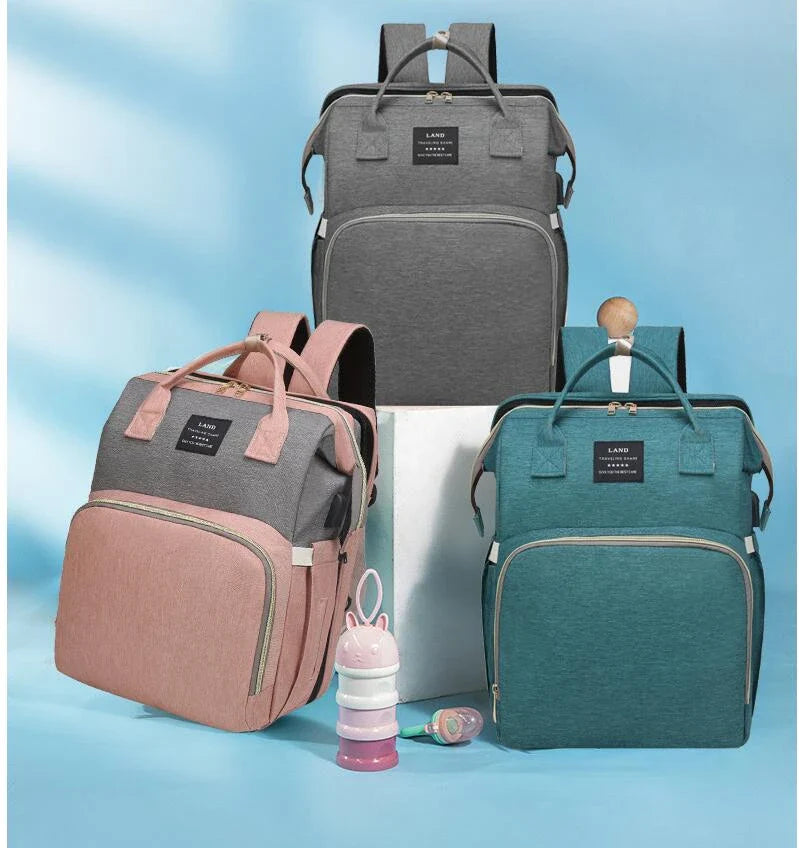 Multifunctional maternity diaper backpack with removable mosquito net, foldable crib, and water-resistant design for convenient family travel