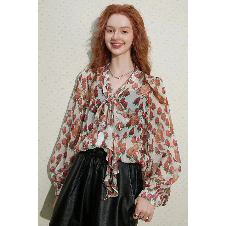 Stylish floral chiffon blouse with elegant lantern sleeves, vibrant patterns, and delicate bow collar