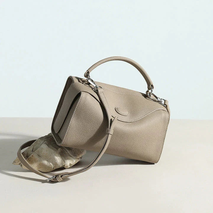 Premium British cowhide leather shoulder bag with multiple interior pockets and adjustable strap for versatile wear