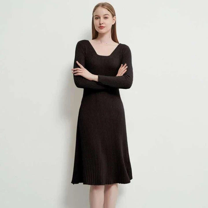 Elegant and cosy midi sweater dress in black, featuring a solid, body-hugging silhouette and comfortable knit fabric