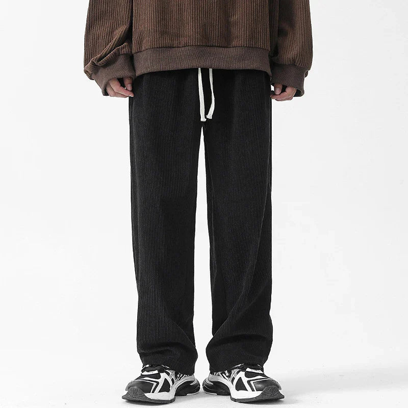 Premium fleece-lined corduroy trousers in a range of versatile colours, featuring a relaxed, straight-leg silhouette for a sophisticated, comfortable look.