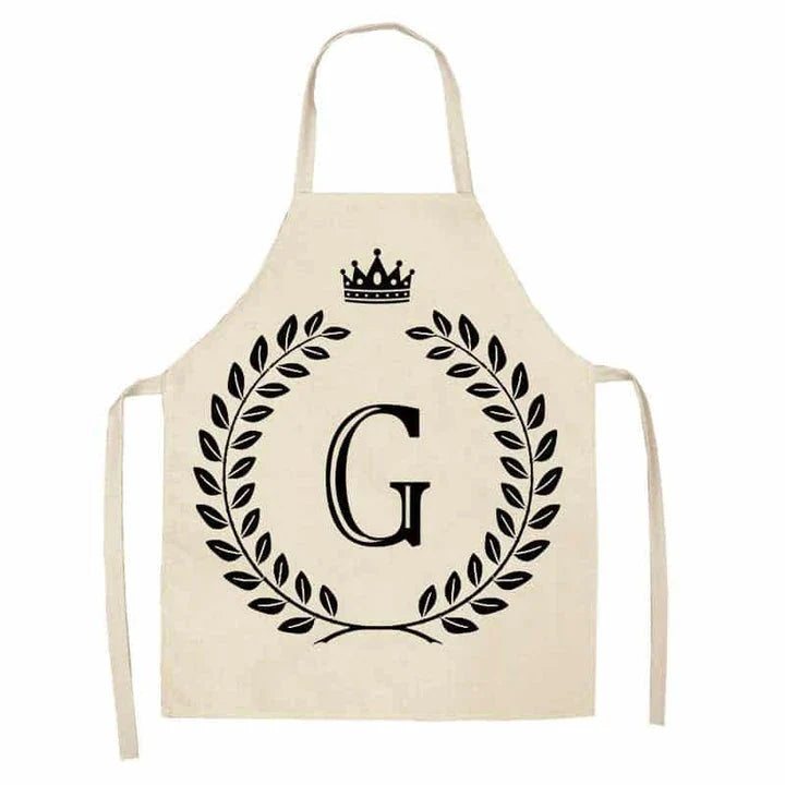 A high-quality kitchen apron featuring a charming crown and letter print design in a premium cotton and linen blend fabric.