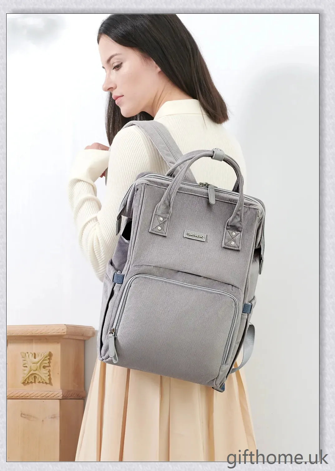 Premium polyester nappy backpack with multiple pockets and adjustable straps, perfect for modern British parents