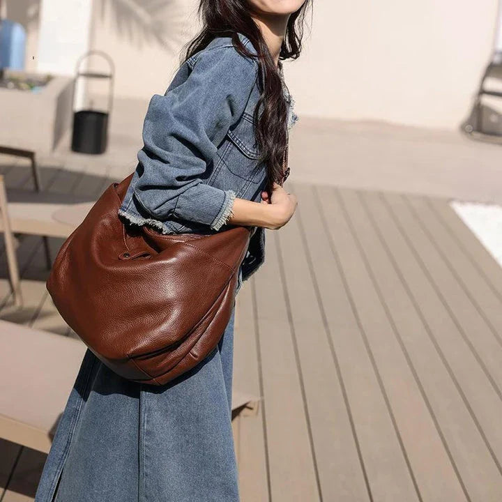 High-quality genuine leather crossbody hobo bag for women with a unique stone pattern and ample interior storage