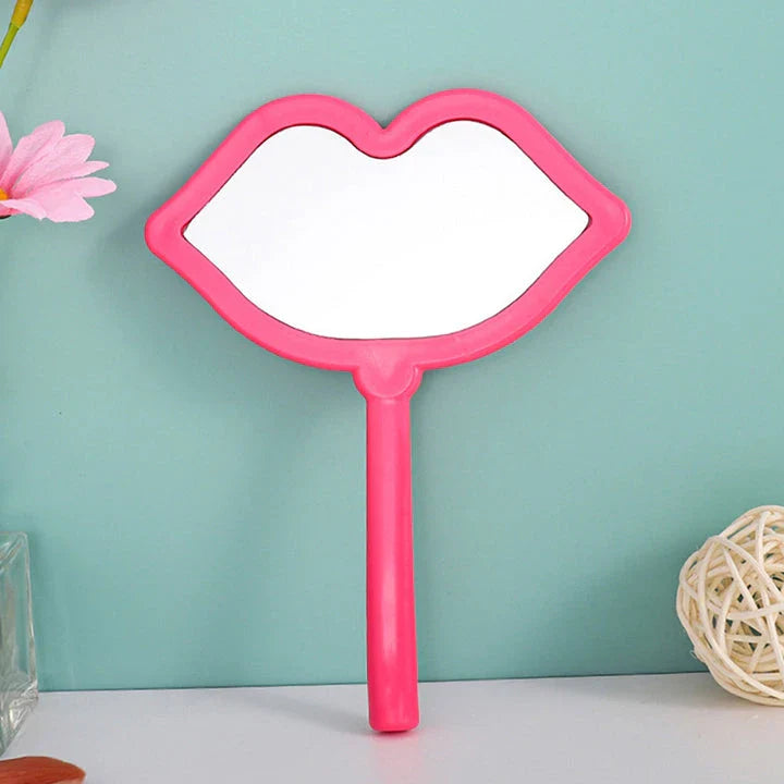 Lip-shaped handheld makeup mirror with a comfortable ergonomic handle for precise on-the-go touch-ups