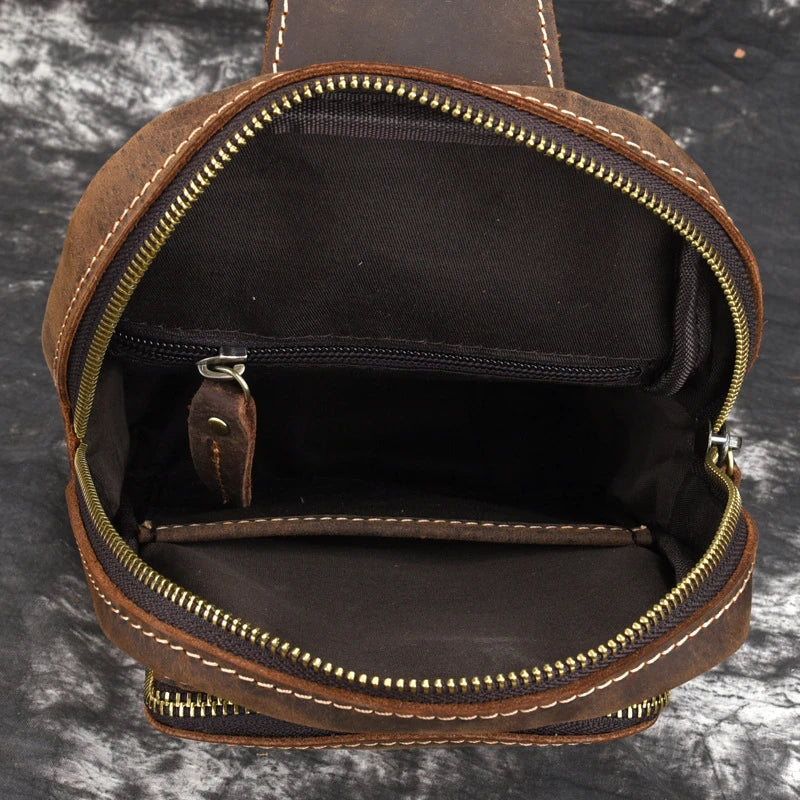 Vintage-inspired genuine leather briefcase with multiple compartments and secure zipper closure, ideal for modern commuters