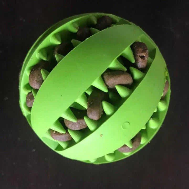 Premium natural rubber interactive ball for dogs in various colours, designed to provide mental stimulation and physical exercise.