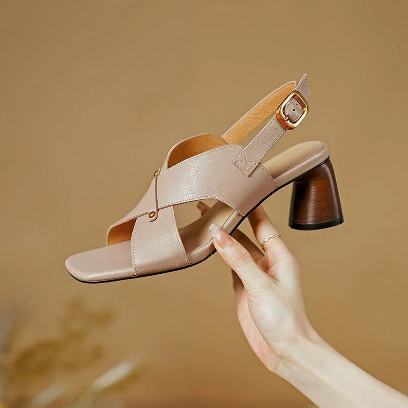 Elegant leather high heel sandals for women, featuring a refined square heel, stylish buckle strap, and sleek design for a sophisticated look.