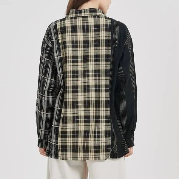A stylish plaid shirt with a unique patchwork design, made from a comfortable cotton-blend fabric.