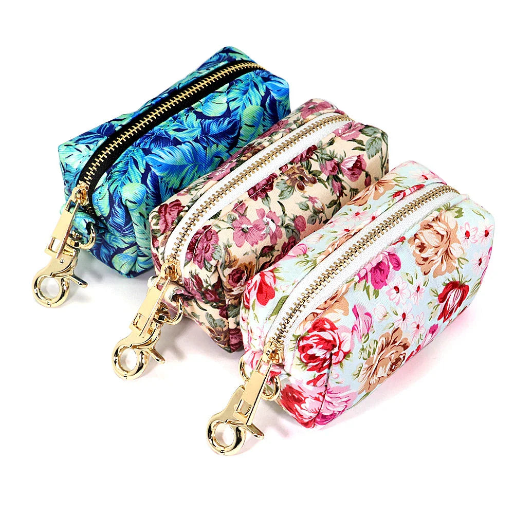 Stylish floral dog walking bag with multiple compartments for treats, snacks, waste bags, and keys